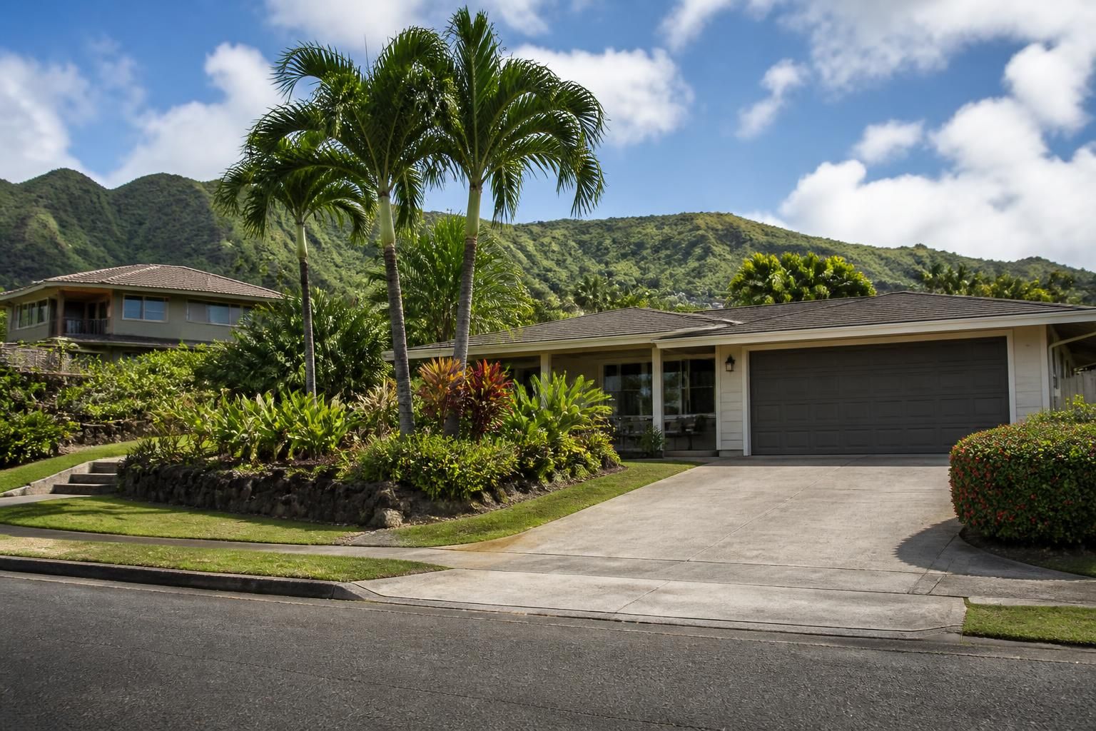 Aina Haina suburban homes with tropical planting and driveways.